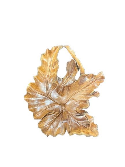 Hand-carved solid wood leaf wall sculpture featuring detailed tropical botanical veins and natural teak root grain, styled for organic modernism luxury interiors.